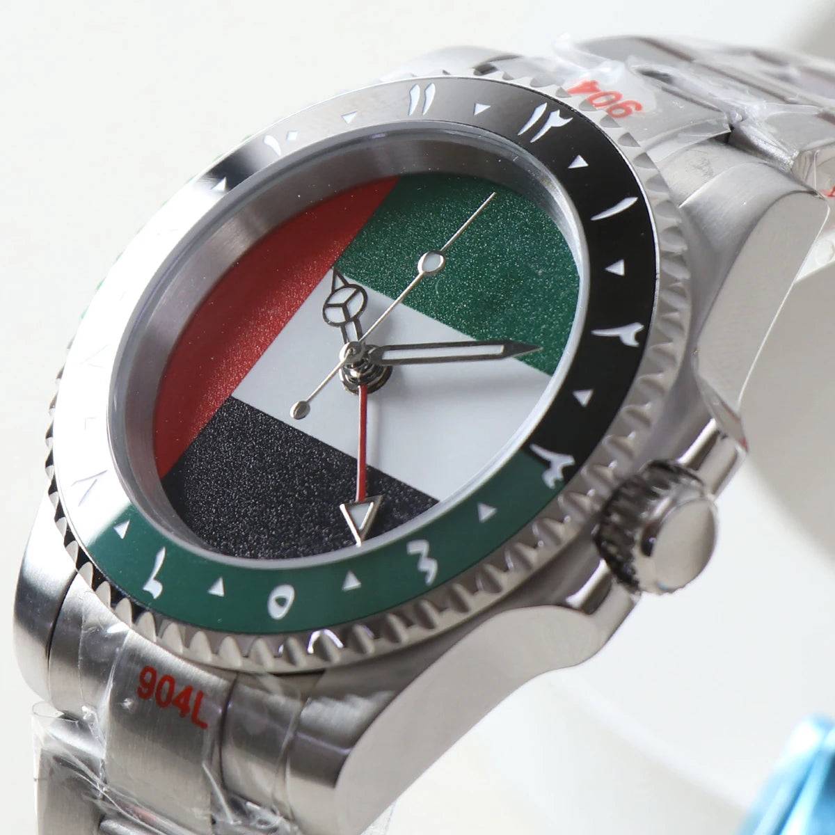 Close-up of NH34 GMT watch featuring a UAE flag dial, green-black bezel, and Arabic numerals. Stainless steel case with automatic mechanical movement.