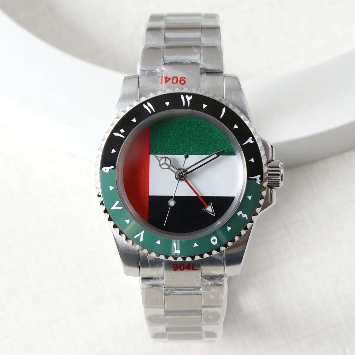 NH34 GMT watch with a UAE flag dial and green-black bezel. Stainless steel case and bracelet with automatic mechanical movement and sapphire crystal.